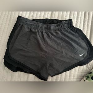 large nike athletic shorts grey and black on sides